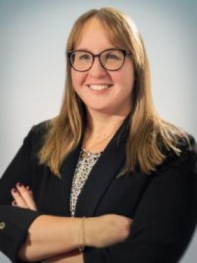 Professional shot of Stacia Baldwin, Employer Representative, Smiling in a black blazer.