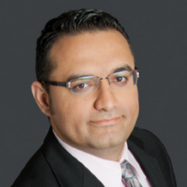 Headshot of Saeed El-Darahali, Chair, Smiling in a black blazer.